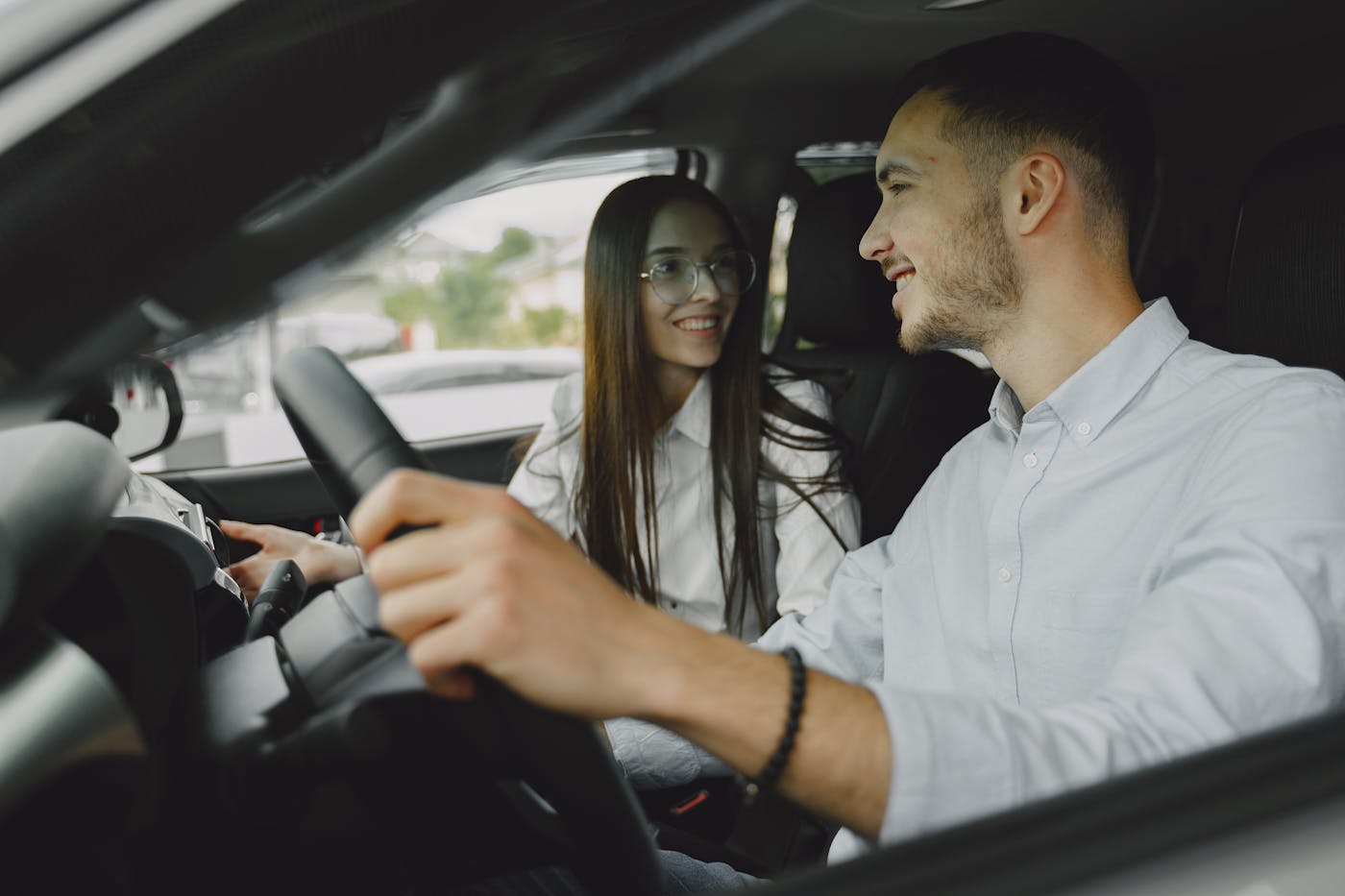 Learner driver behind the wheel with an instructor in the passenger seat